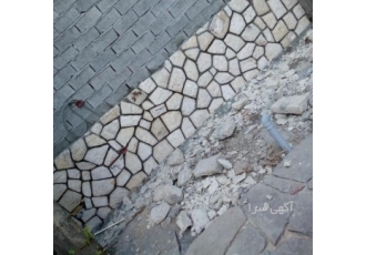 اجرای سنگ لاشه کف دیوار با سنگ